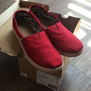 Toms red canvas shoes